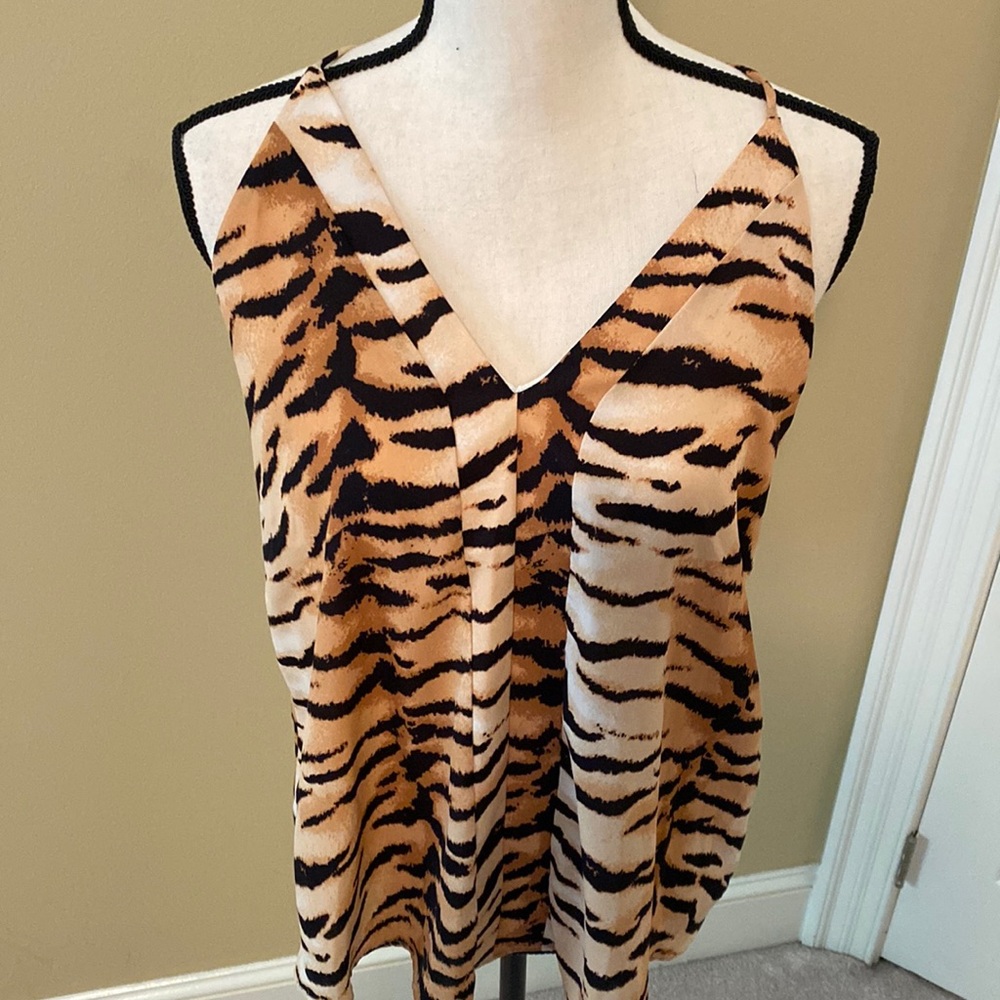 Brand new flowy tank in tiger print. Size small.